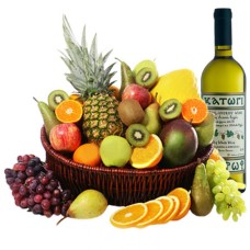 Frutas exóticas y vino blanco en una canasta (pequeña)