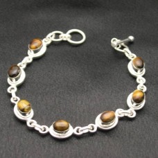 Pulsera de cadena de plata esterlina y cabujones de ojo de tigre, elaborada por un artista.