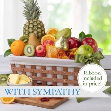 Cesta de frutas de condolencia con cinta de pésame.