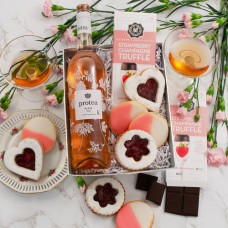 Caja de regalo con vino blanco Riesling y fruta.