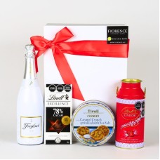 Regalo con vino blanco espumoso y bombones.