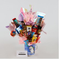 Ramo mágico de caramelos con peluche de unicornio.