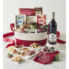 Cesta de regalo con los mejores snacks de la temporada, con adorno personalizado y vino.