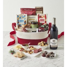 Cesta de regalo con los mejores aperitivos de la temporada y vino.