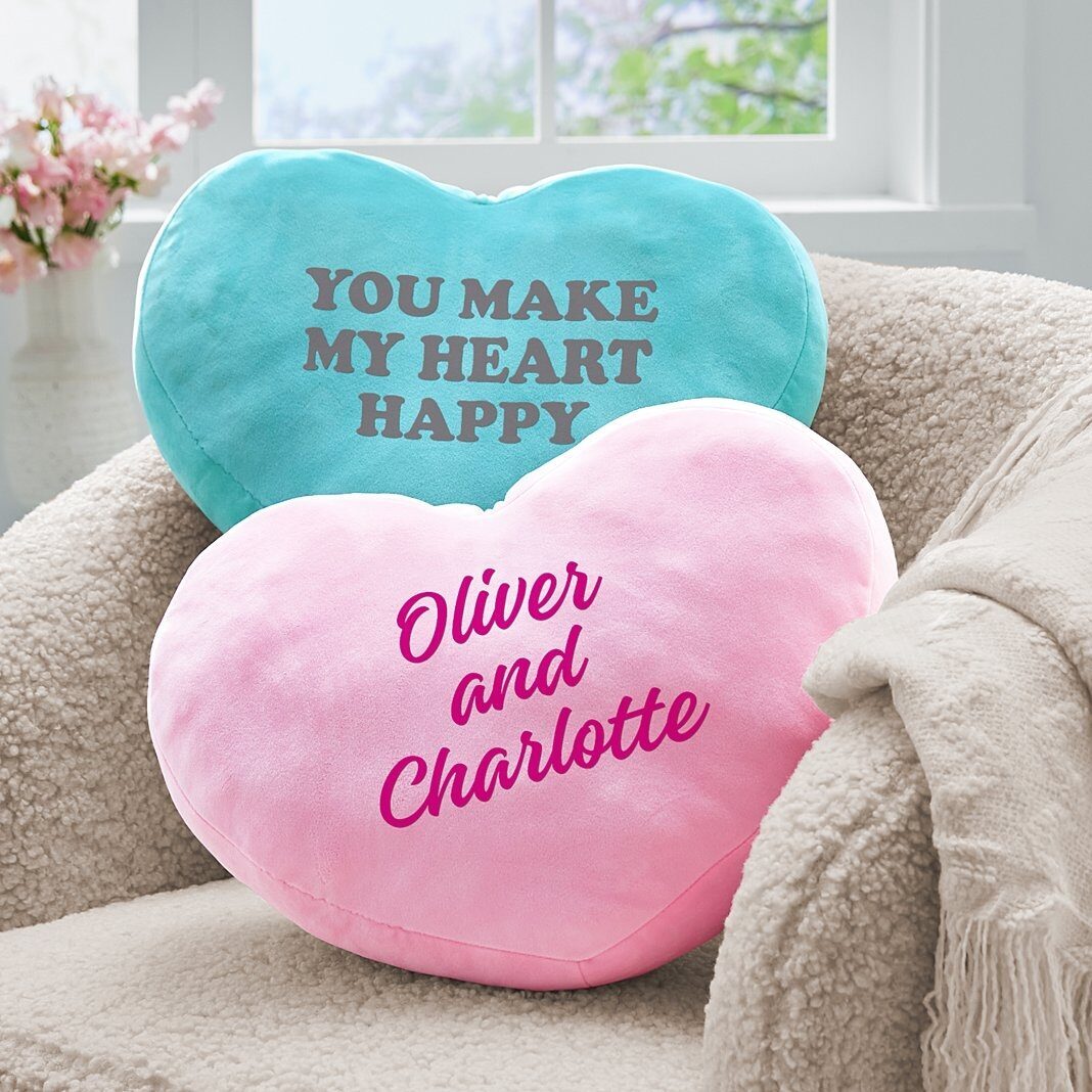 Almohada de peluche con mensaje en forma de corazón