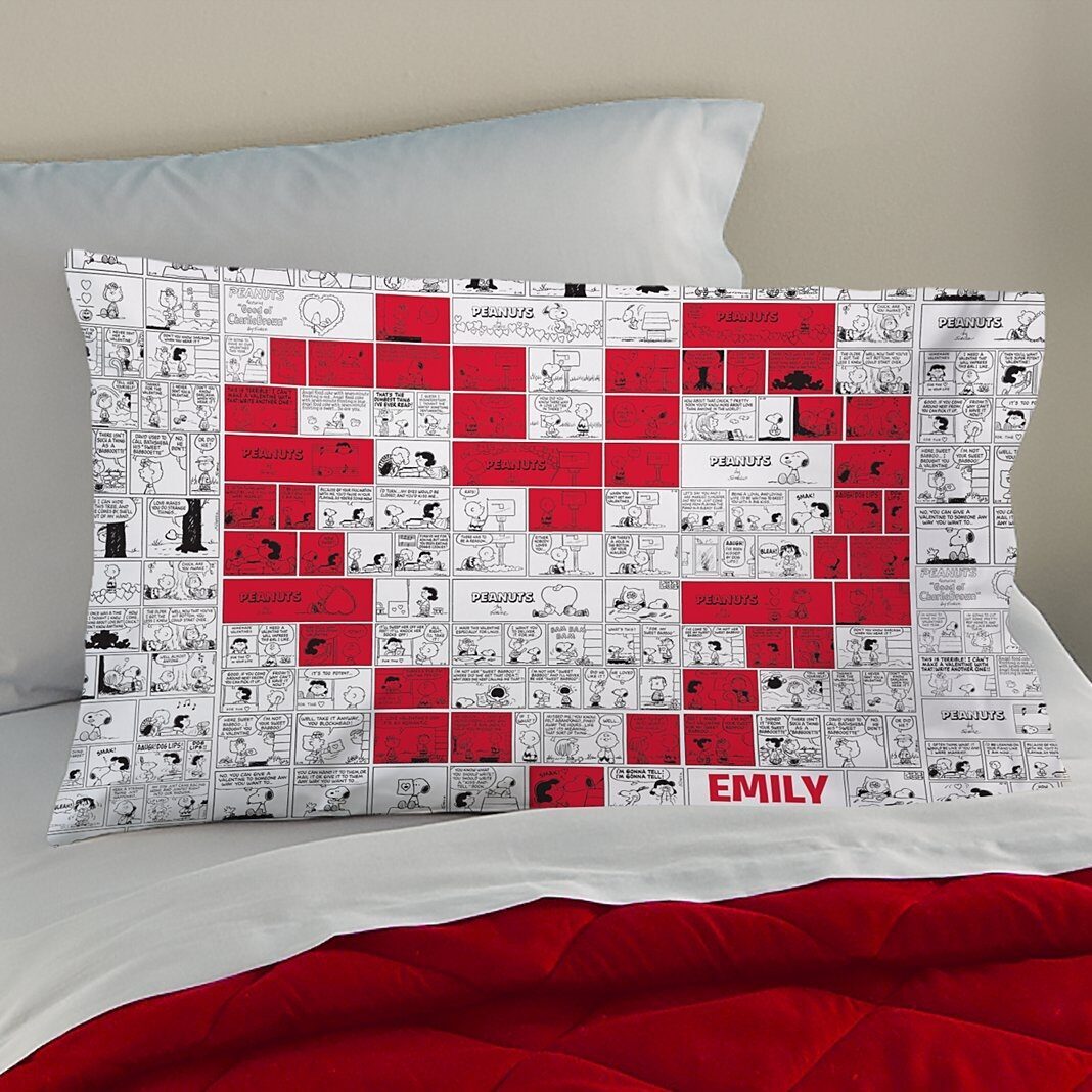 Funda de almohada con tira cómica de corazón de PEANUTS®