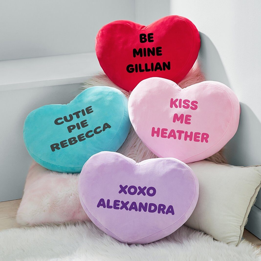 Almohada de peluche con mensaje en forma de corazón
