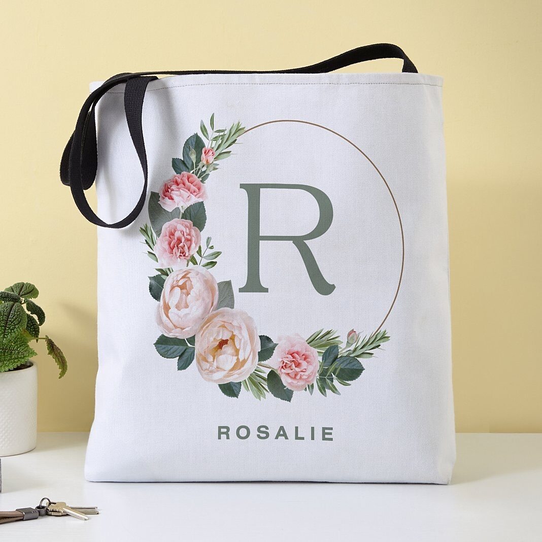 Bolso tote con monograma y anillo floral