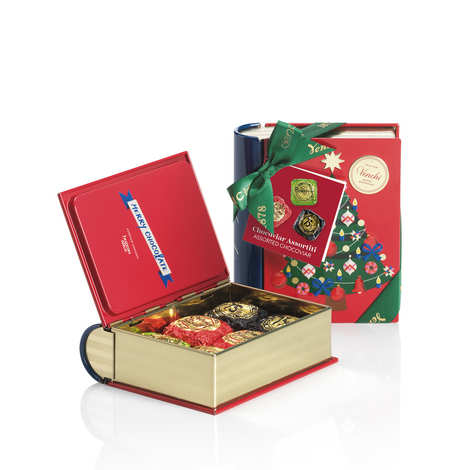 Mini libro metálico lleno de bocaditos de chocolate Chocoviar al 75%, Crème brûlée y pistacho.