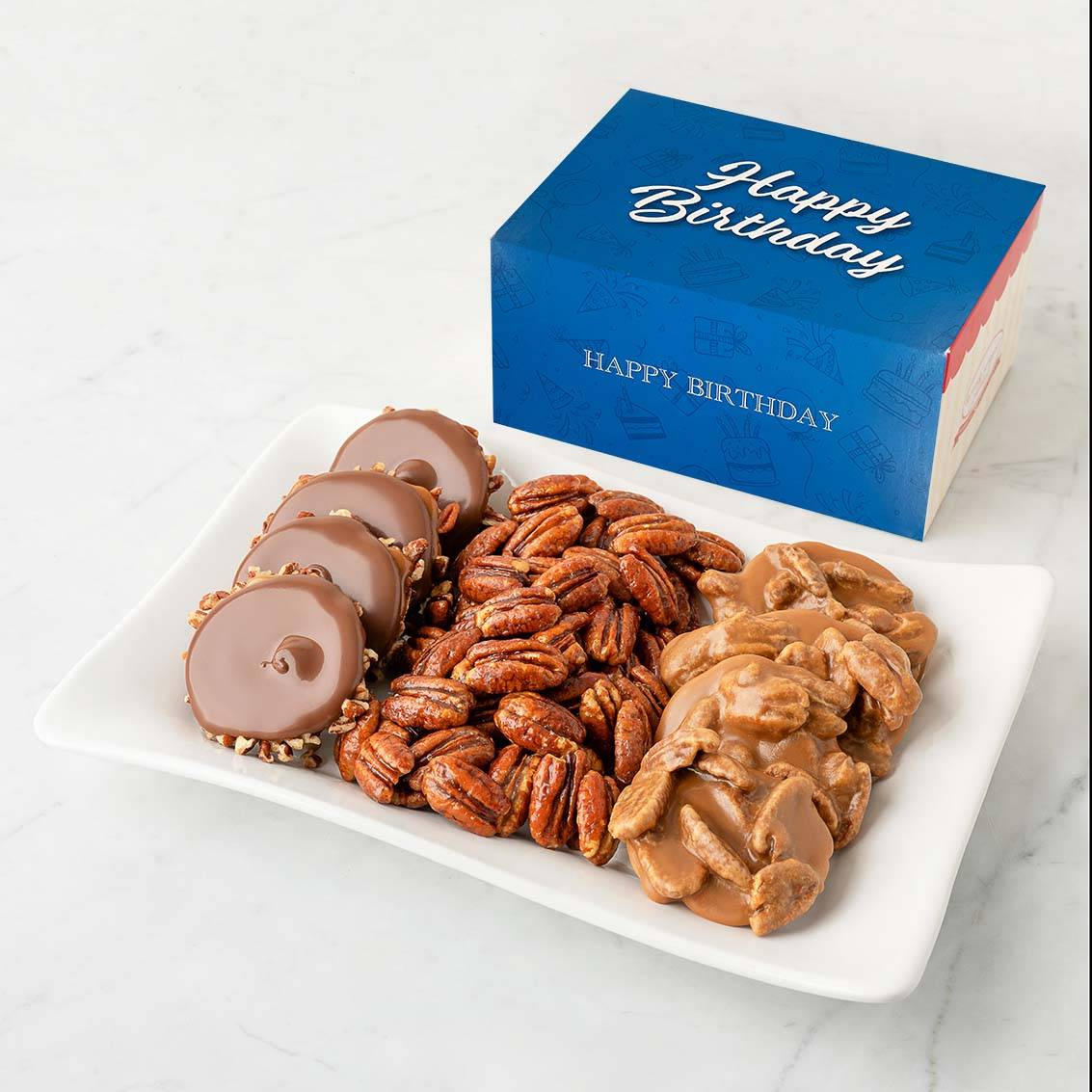 Colección de cumpleaños de pralinés, garras de oso y nueces pecanas glaseadas.